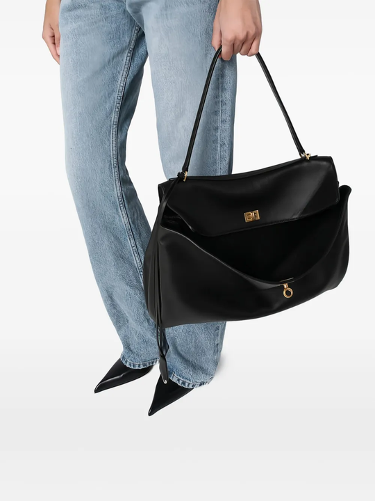Black bag worn by a person, showing the bag fit