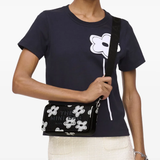 Black bag worn by a person, showing the bag fit