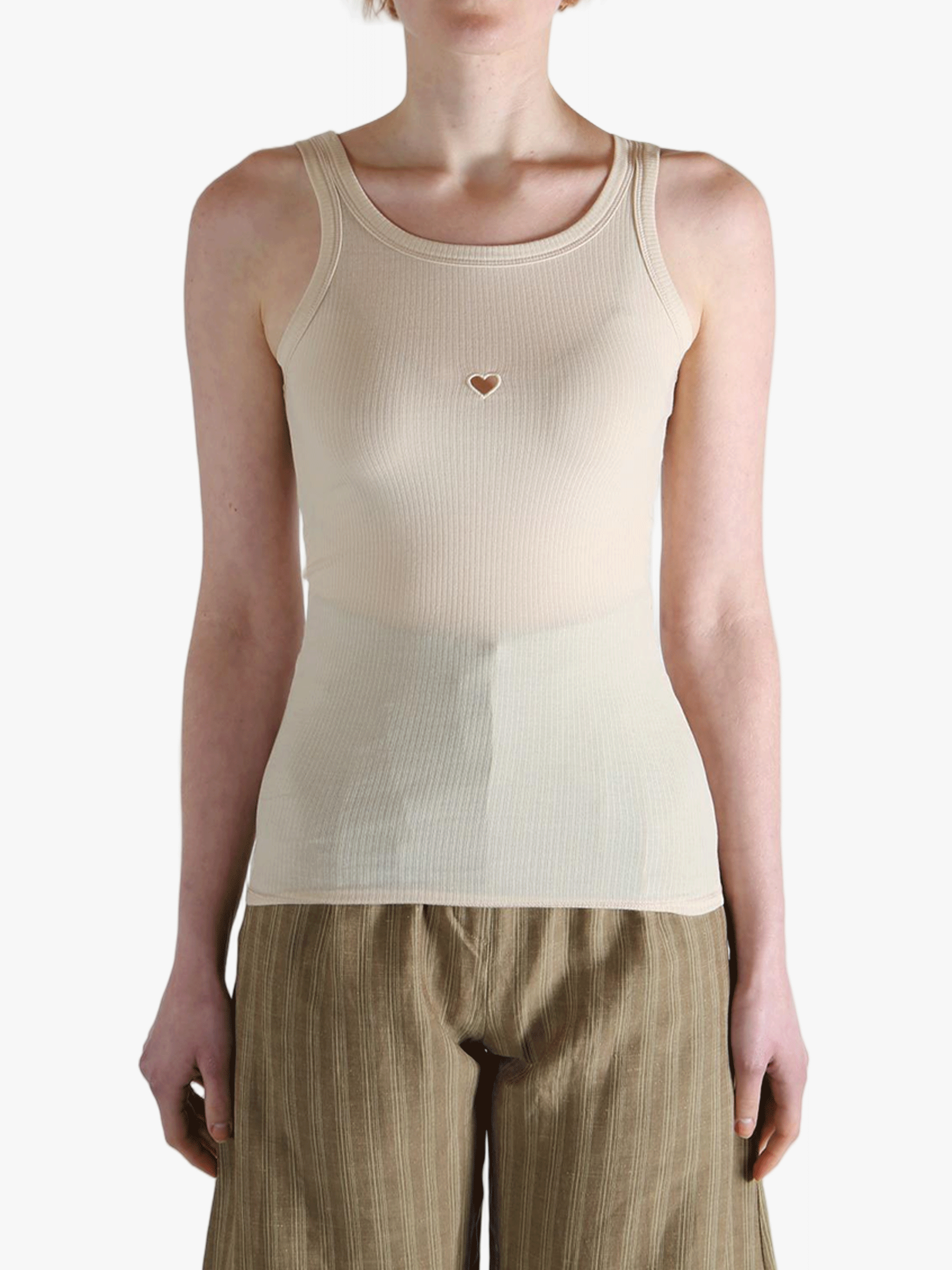 White top worn by a person, showing the top's fit