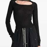 Black top worn by a person, showing the top fit