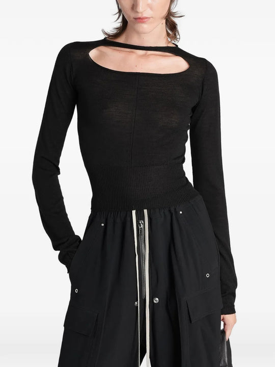 Black top worn by a person, showing the top fit