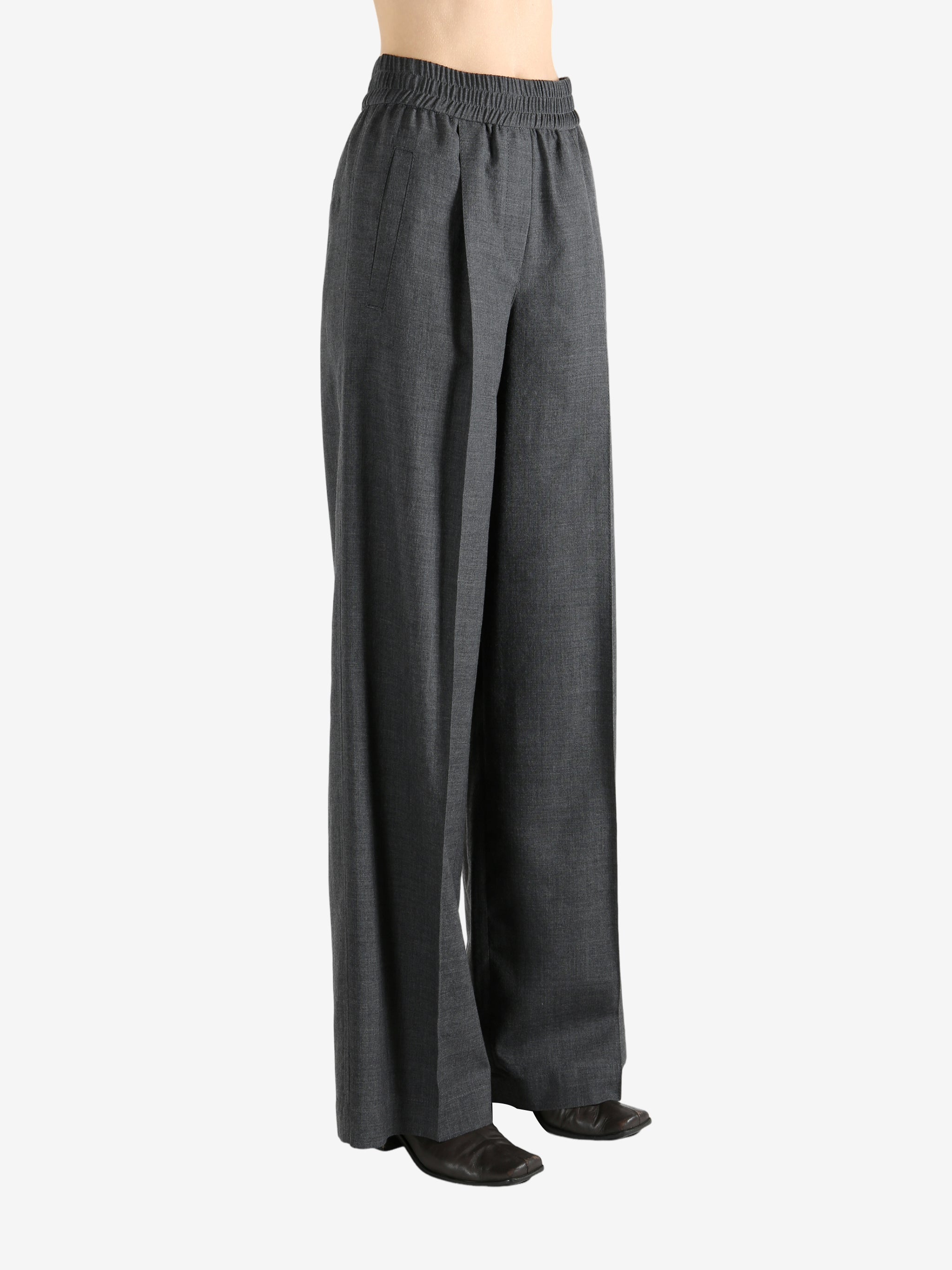 Grey pants worn by a person, showing the pants fit