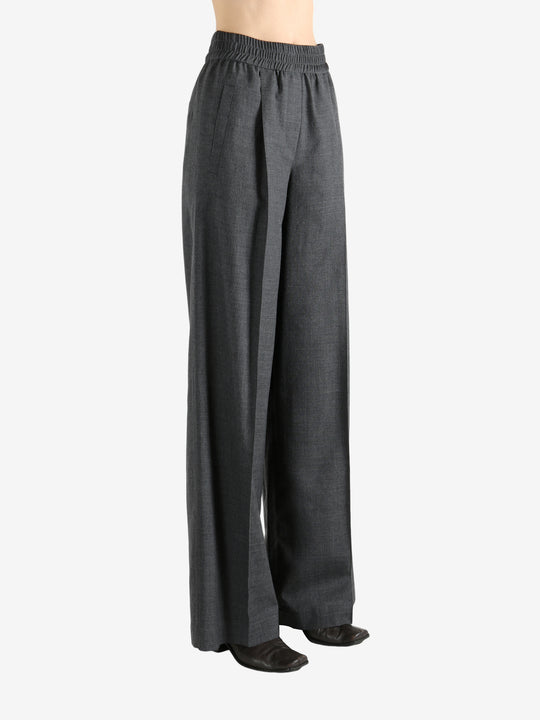 Grey pants worn by a person, showing the pants fit