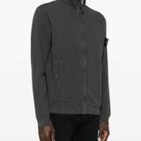 Grey jacket worn by a person, showing the grey jacket's fit