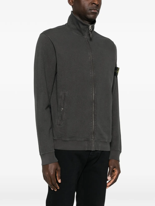 Grey jacket worn by a person, showing the grey jacket's fit
