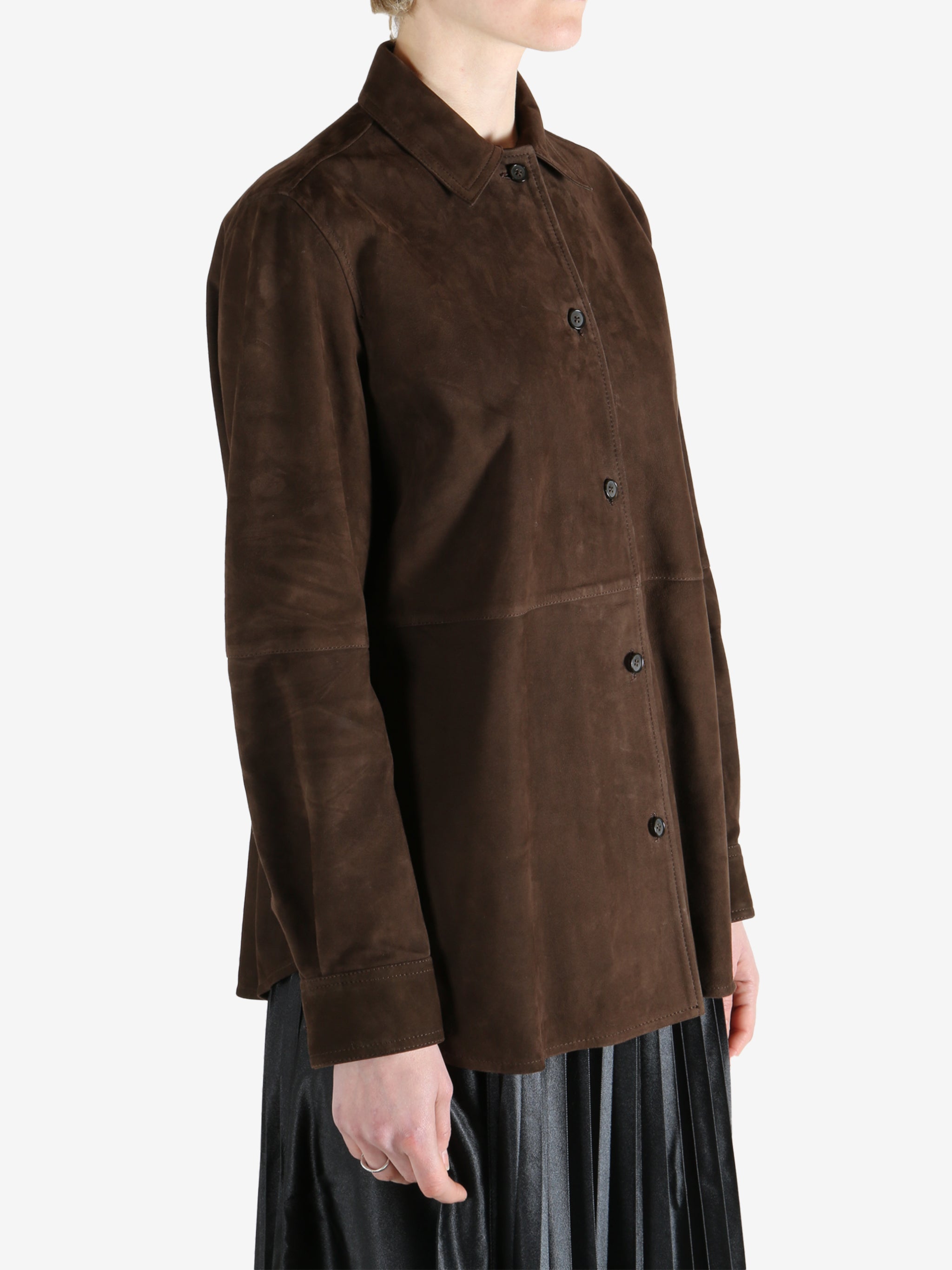 Brown shirts worn by a person, showing the shirts fit