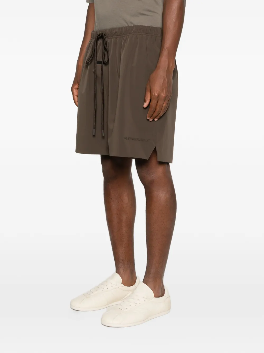 Brown shorts worn by a person,showing the shorts fit