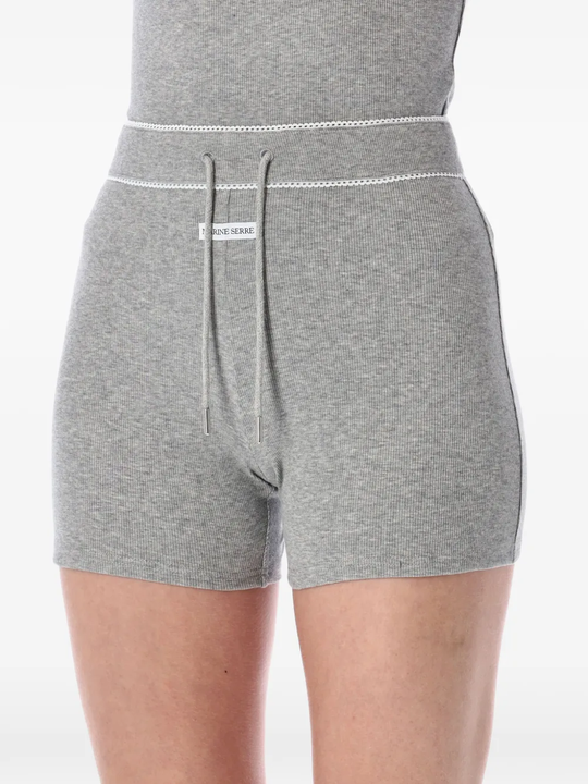 Close up of the grey shorts, showing texture of the cotton fabric