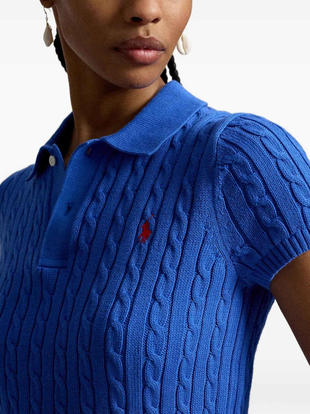 Close up of blue knitted polo shirt,showing texture of the cotton fabric