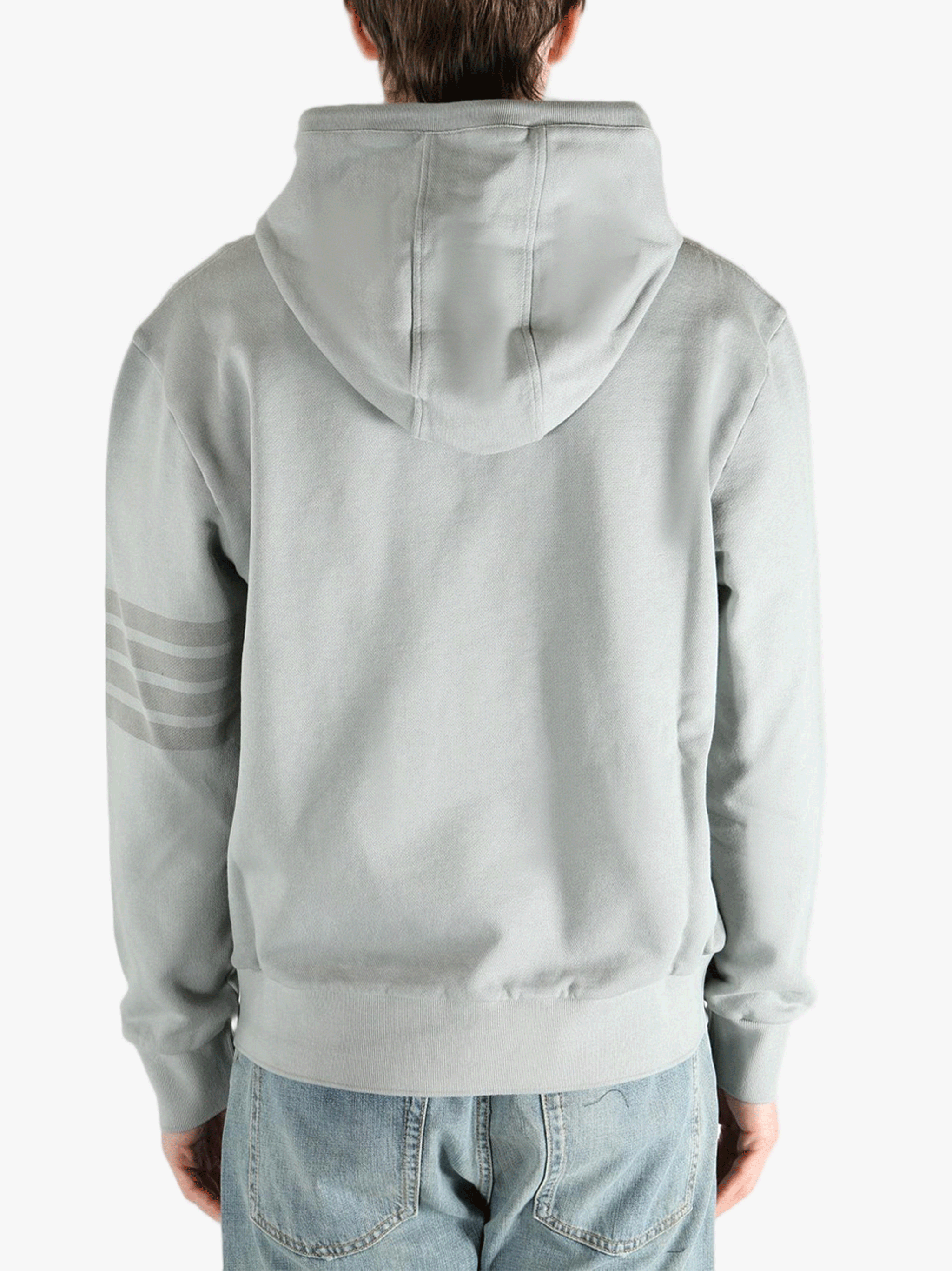 Grey hoodie worn by a person, showing the hoodie fit