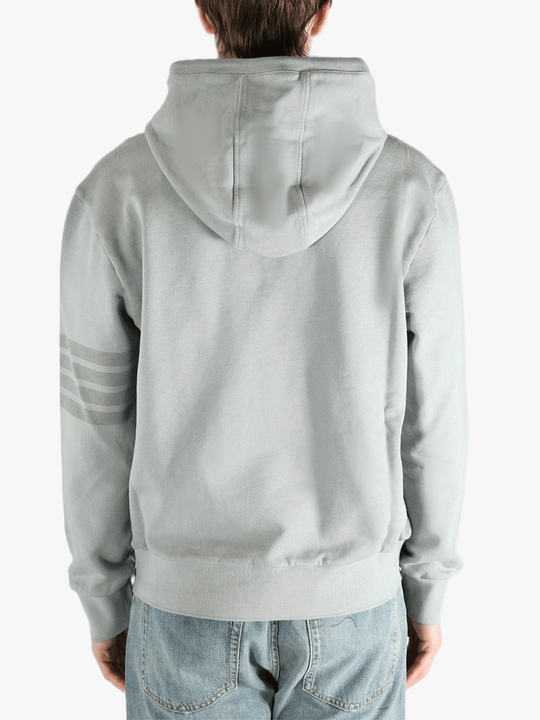 Grey hoodie worn by a person, showing the hoodie fit