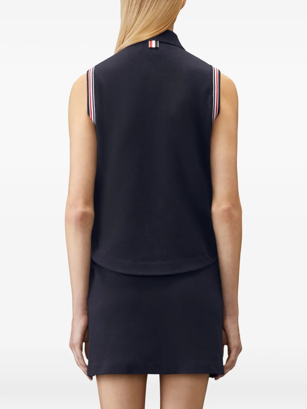 Navy shirt worn by a person, showing the shirt fit