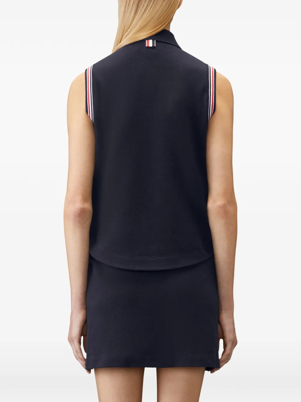 Navy shirt worn by a person, showing the shirt fit