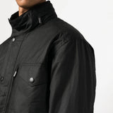 Black jacket worn by a person, showing the jacket fit