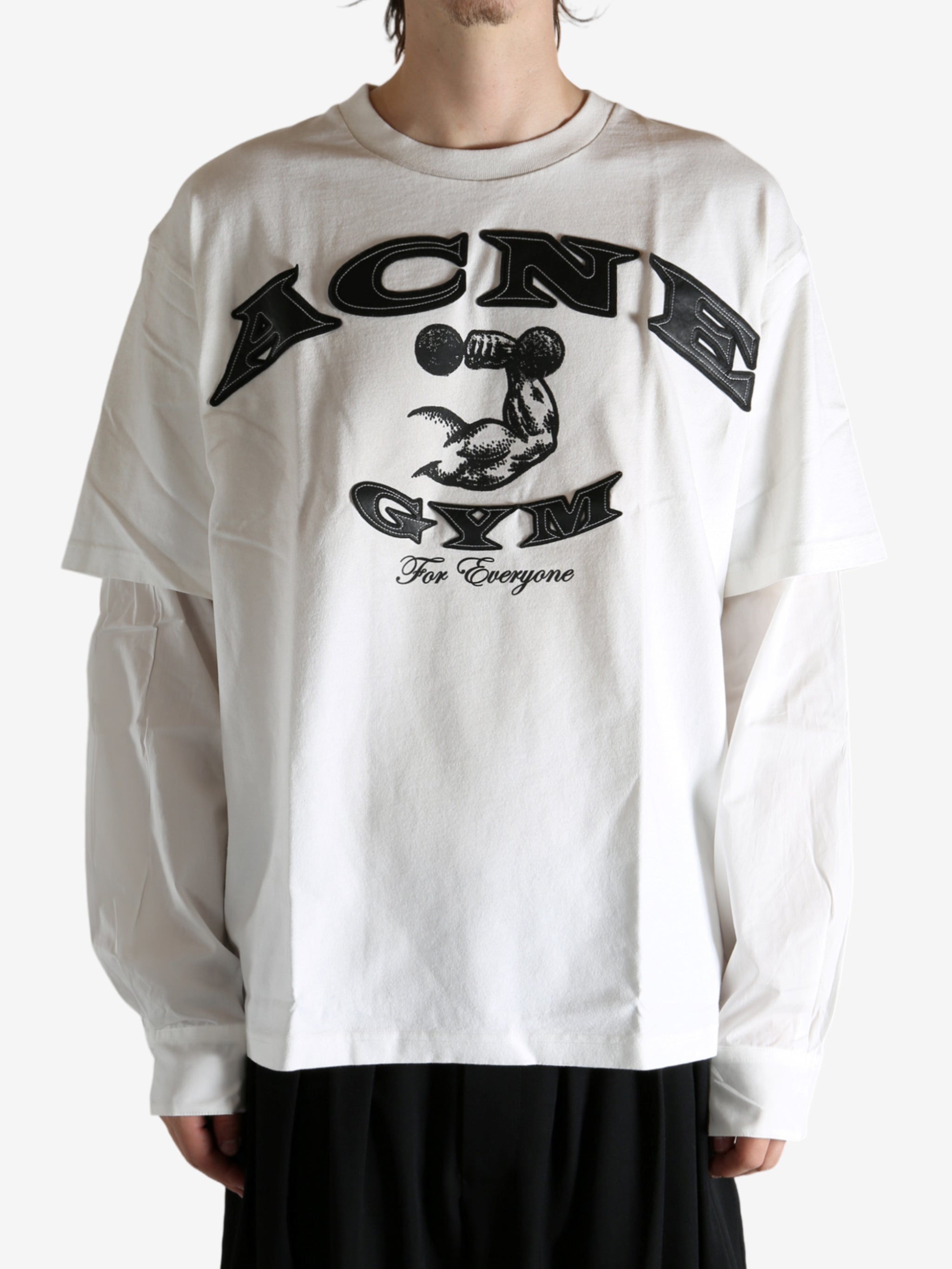 White T-shirt worn by a person, showing the T-shirt's fit