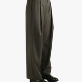 Brown pants worn by a person, showing the pants's fit
