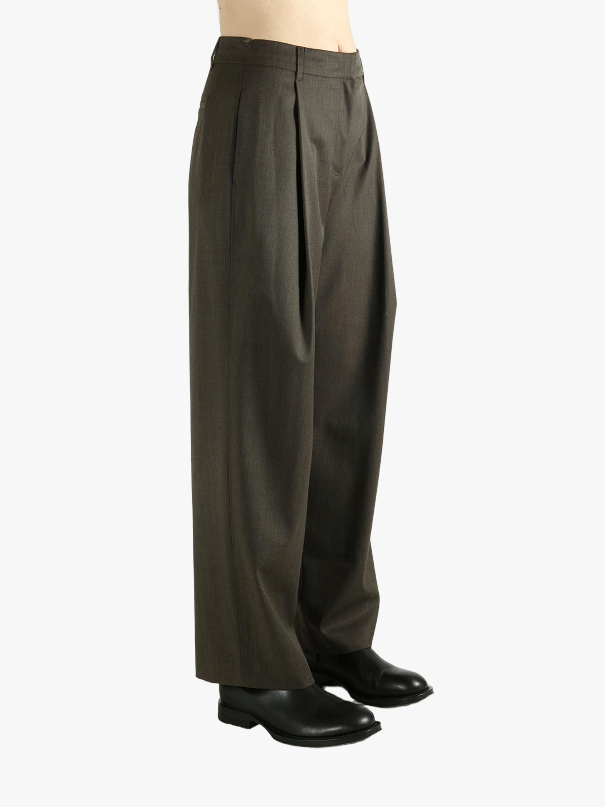 Brown pants worn by a person, showing the pants's fit