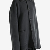 Grey jacket worn by a person, showing the jacket's fit