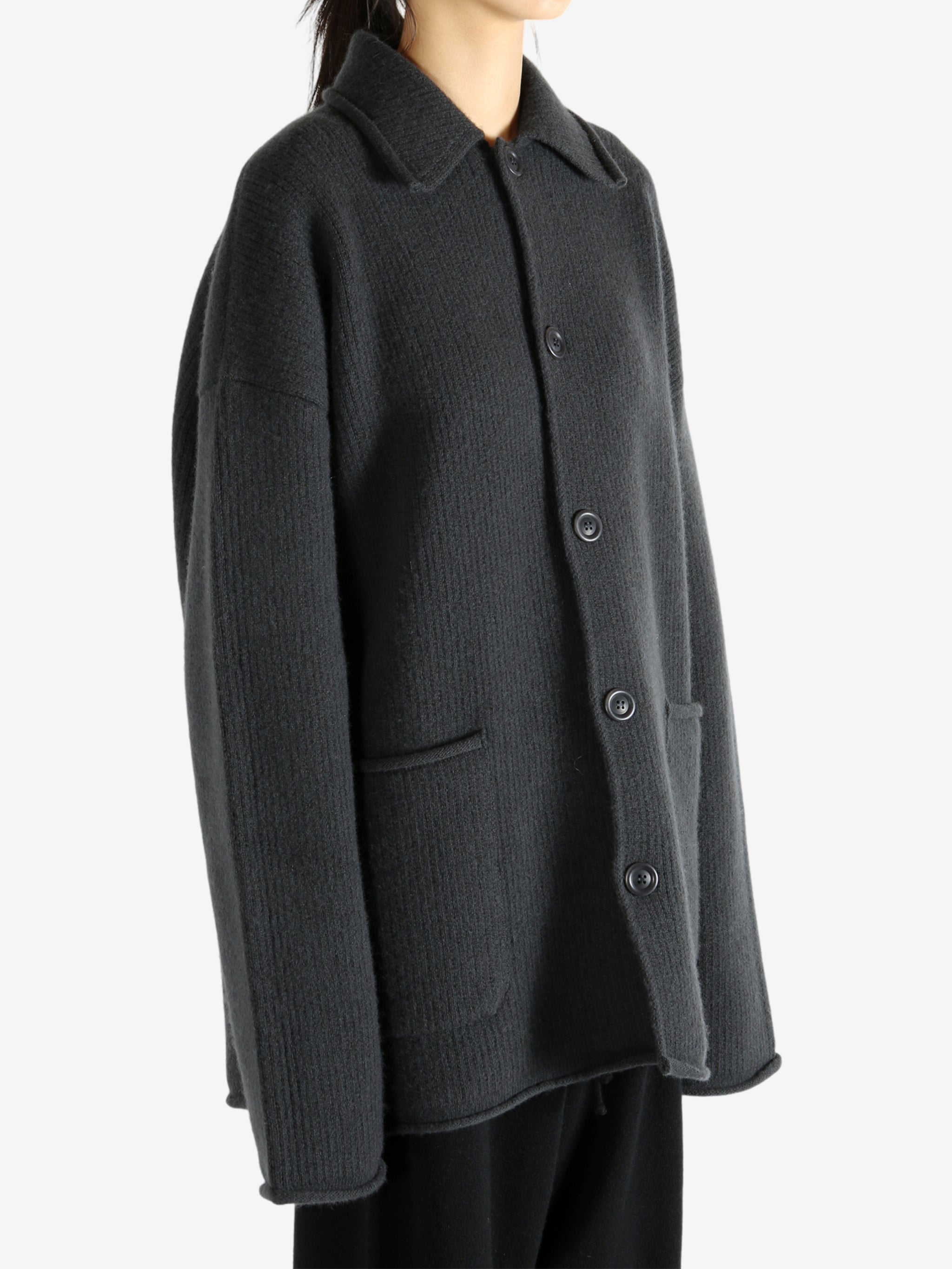 Grey jacket worn by a person, showing the jacket's fit