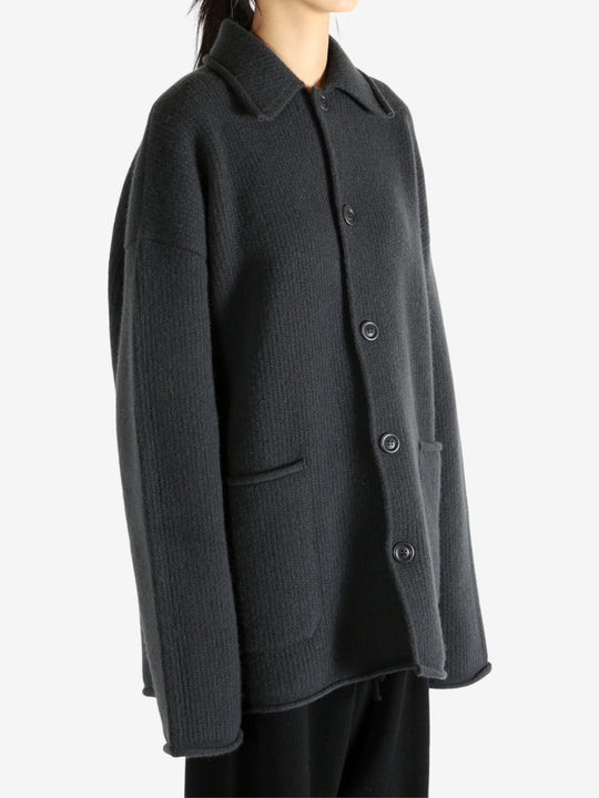 Grey jacket worn by a person, showing the jacket's fit