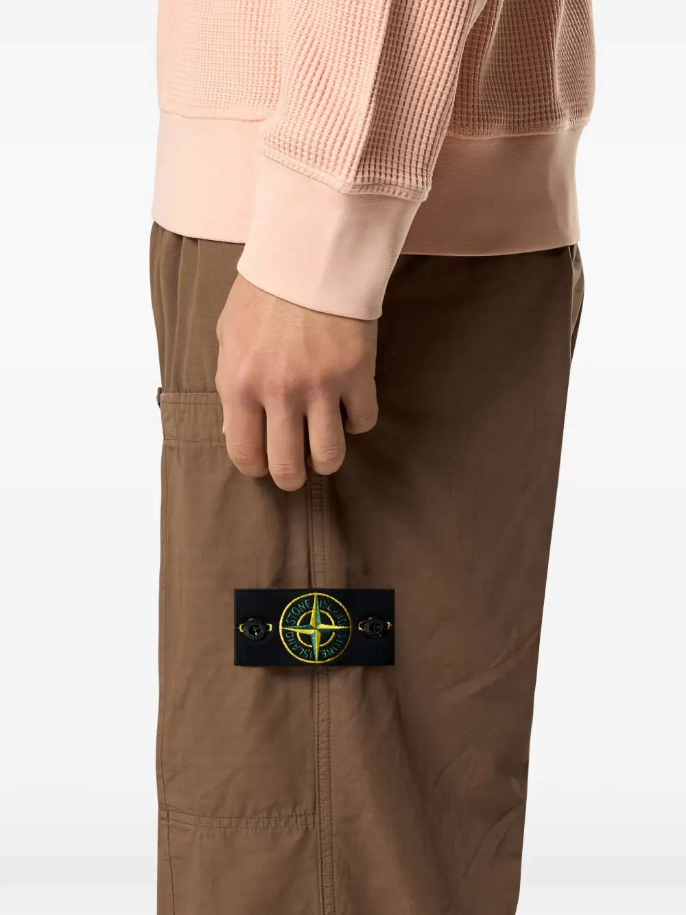 Close up of brown pants, showing texture of the cotton fabric