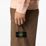 Close up of brown pants, showing texture of the cotton fabric