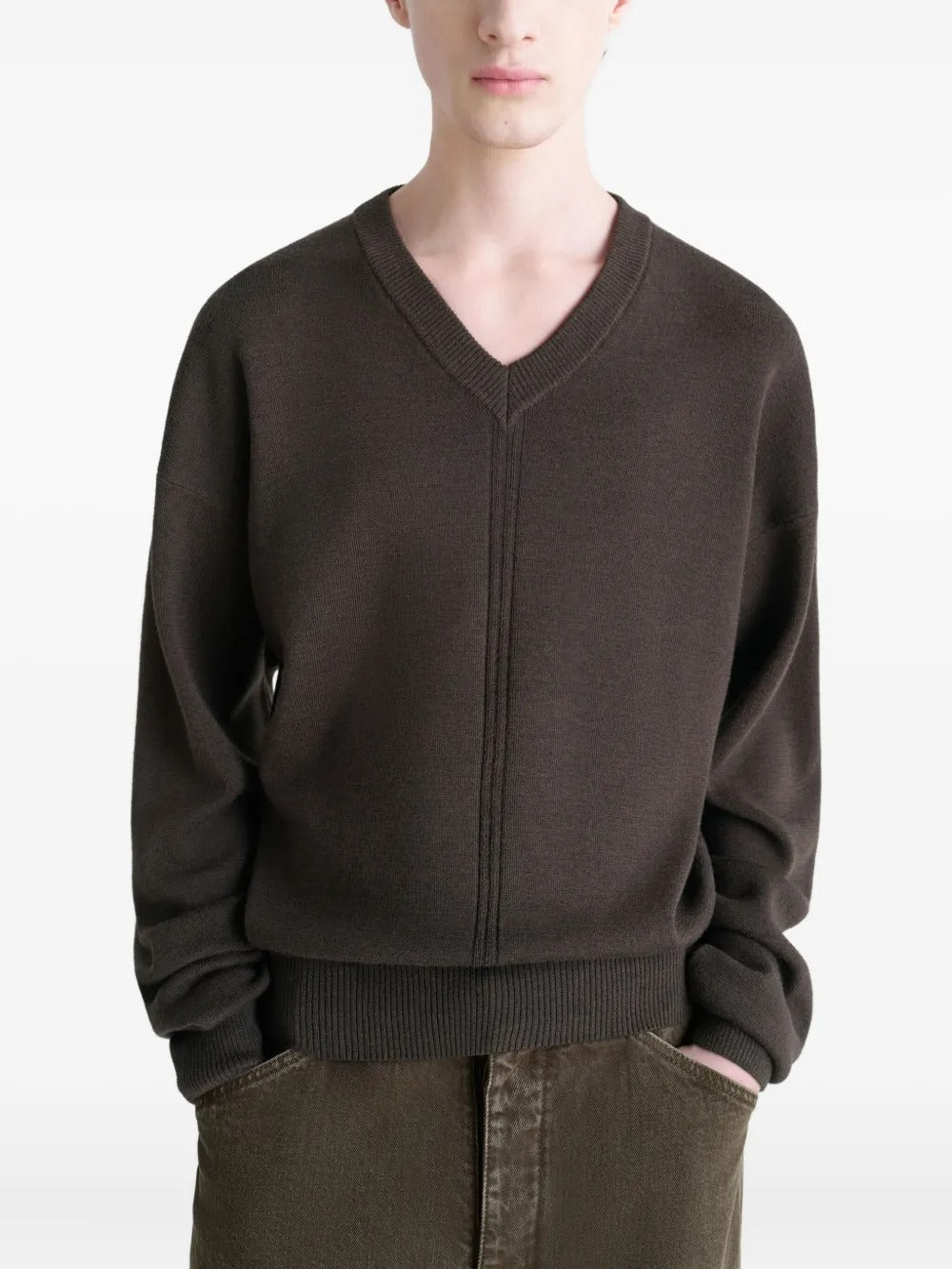Brown sweater worn by a person, showing the sweater's fit