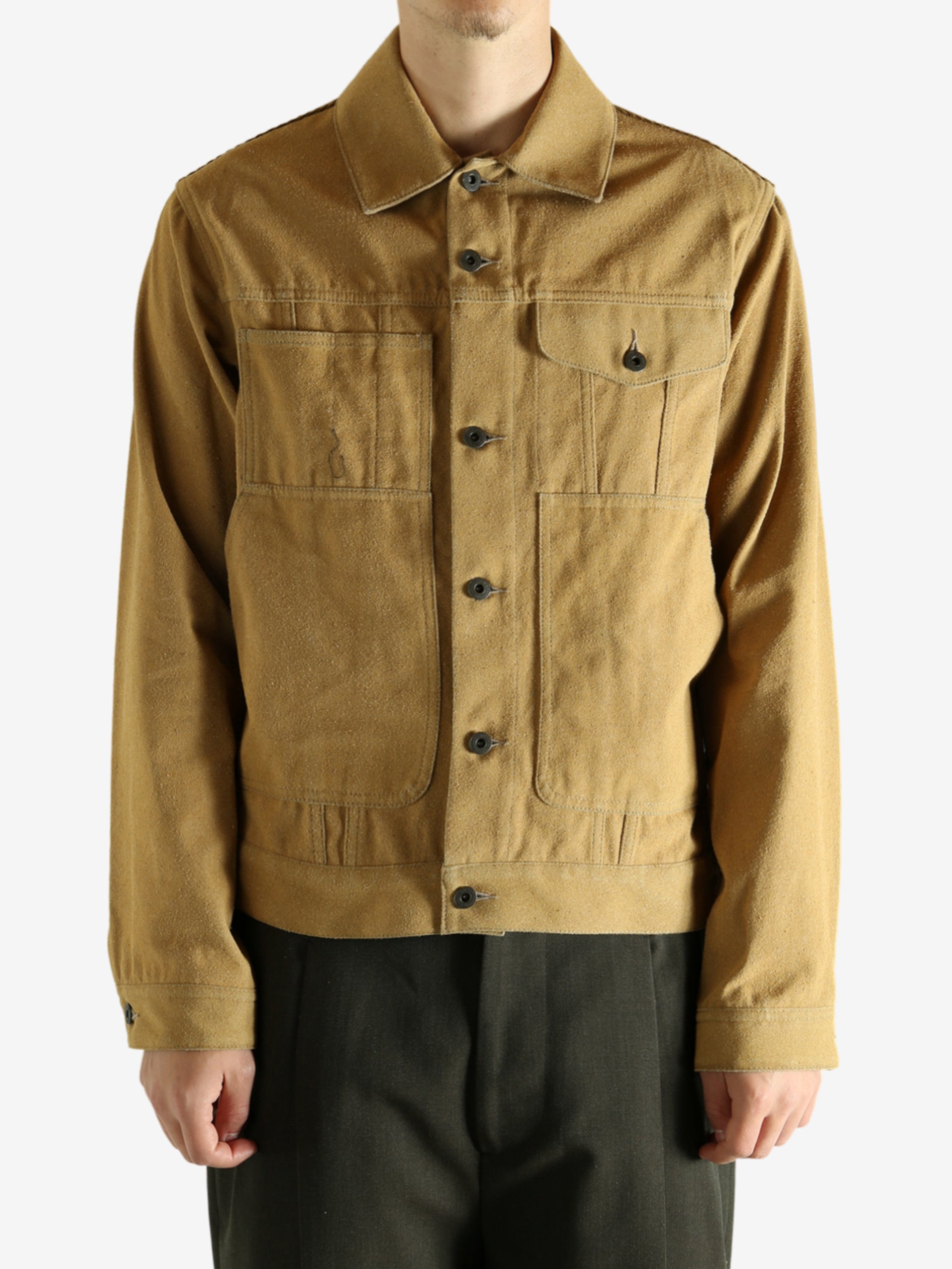 Yellow jacket worn by a person, showing the jacket's fit