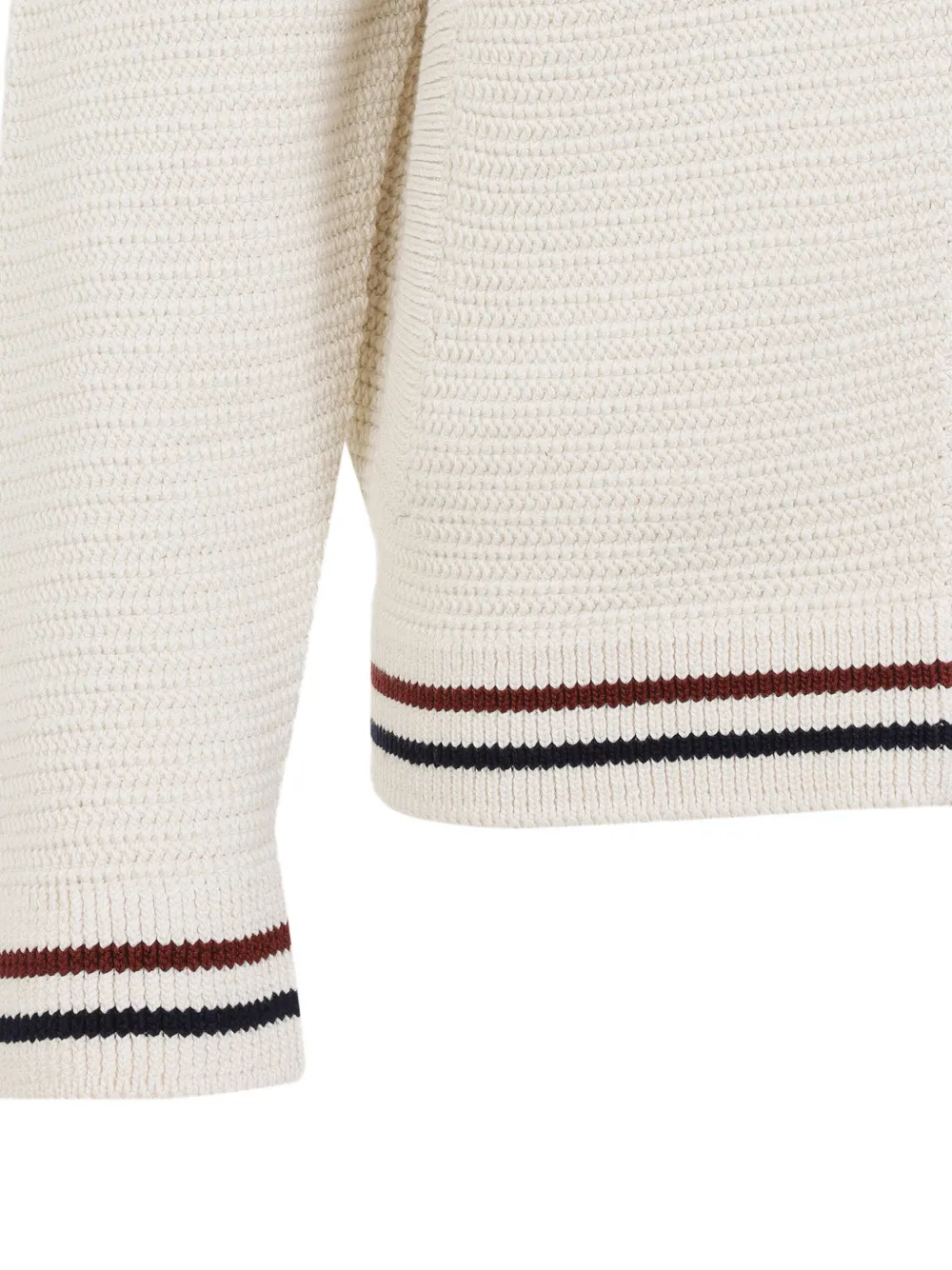 Close up of the White knitwear, showing texture of the cotton fabric