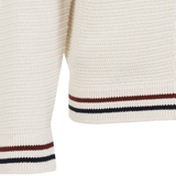 Close up of the White knitwear, showing texture of the cotton fabric