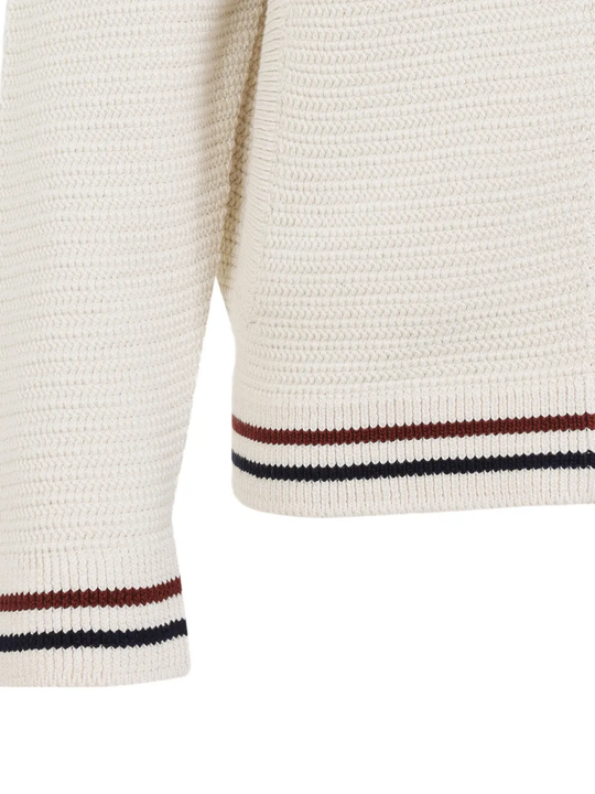Close up of the White knitwear, showing texture of the cotton fabric