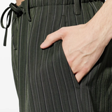 Close up of green pant, showing texture of the viscose fabric