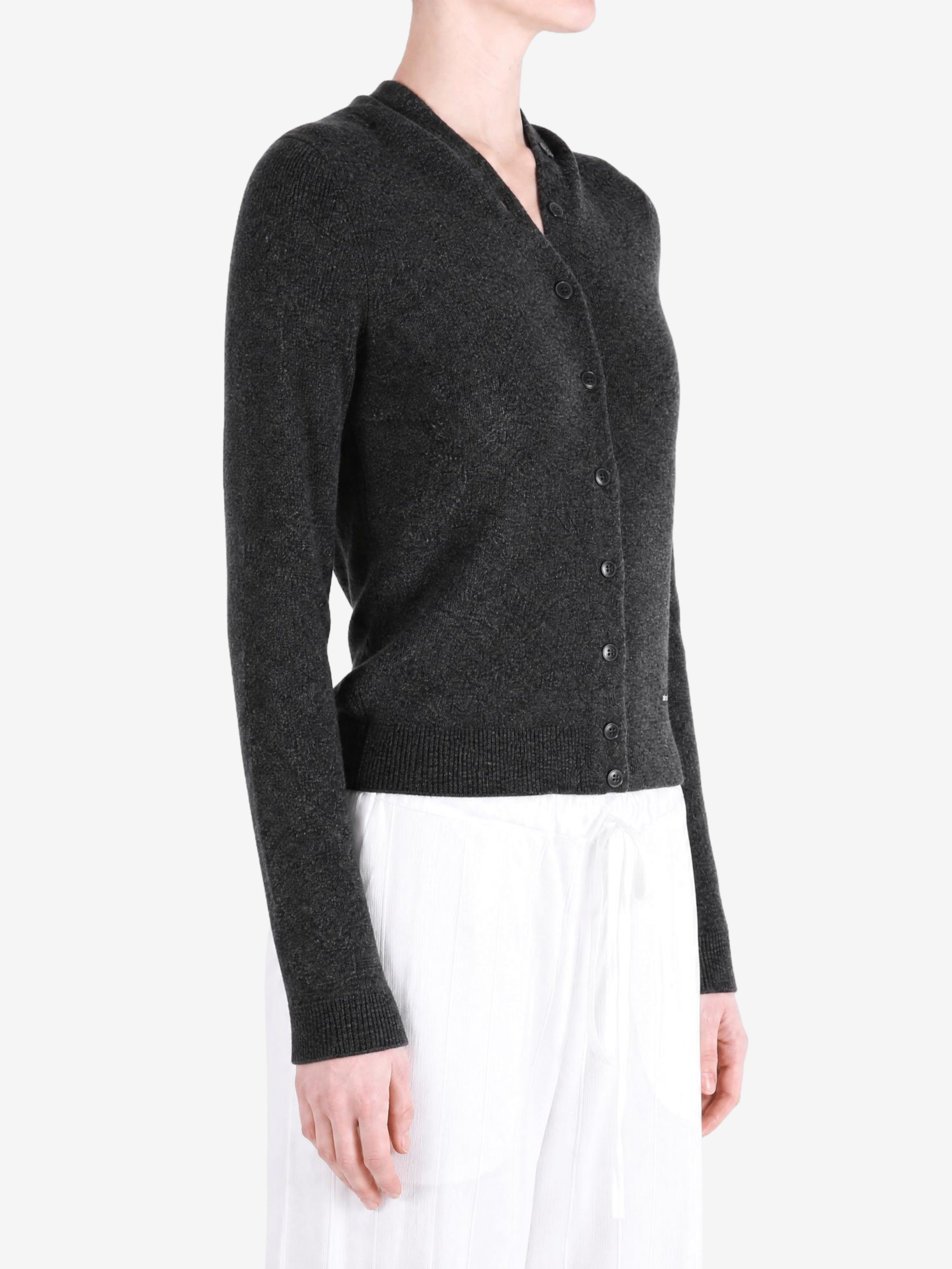 Grey knitwear worn by a person, showing the knitwear fit