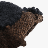 Close up of Brown hat, showing texture of the 100% wool fabric