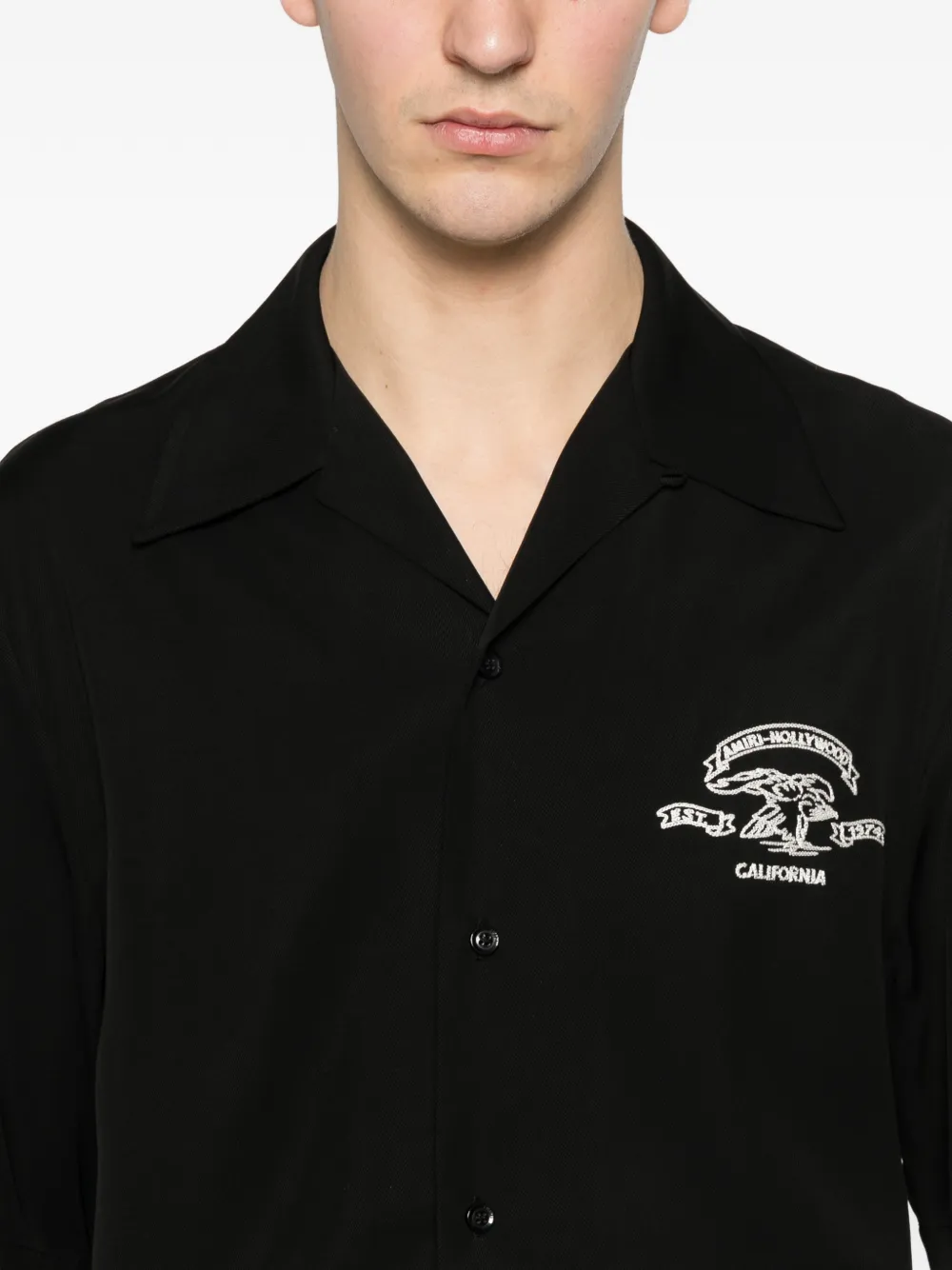 Close up of black shirt, showing texture of the Cotton and Viscose fabric