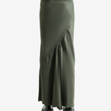 Green skirt worn by a person, showing the skirt fit