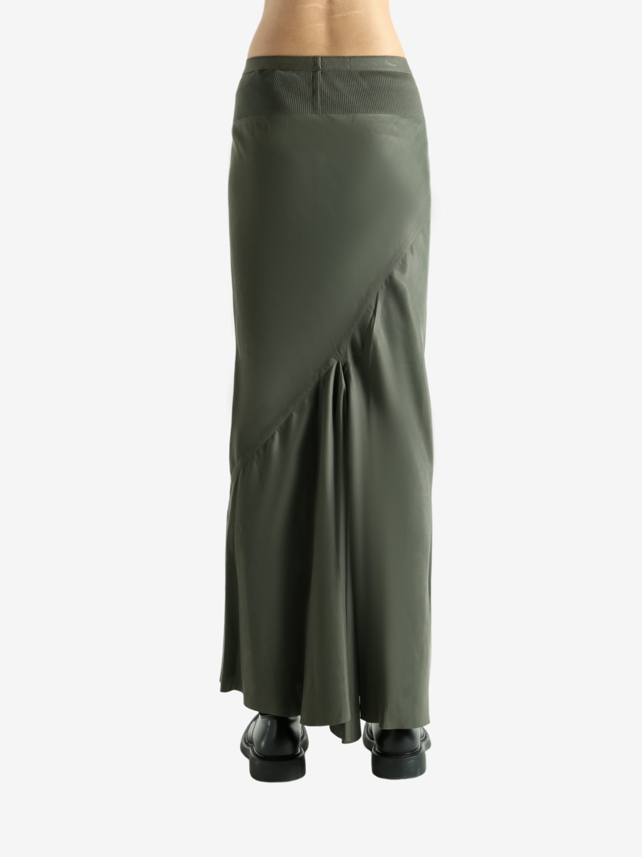 Green skirt worn by a person, showing the skirt fit
