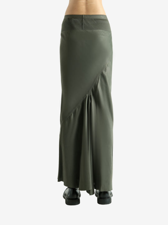 Green skirt worn by a person, showing the skirt fit