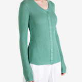 Green top worn by a person, showing the top fit