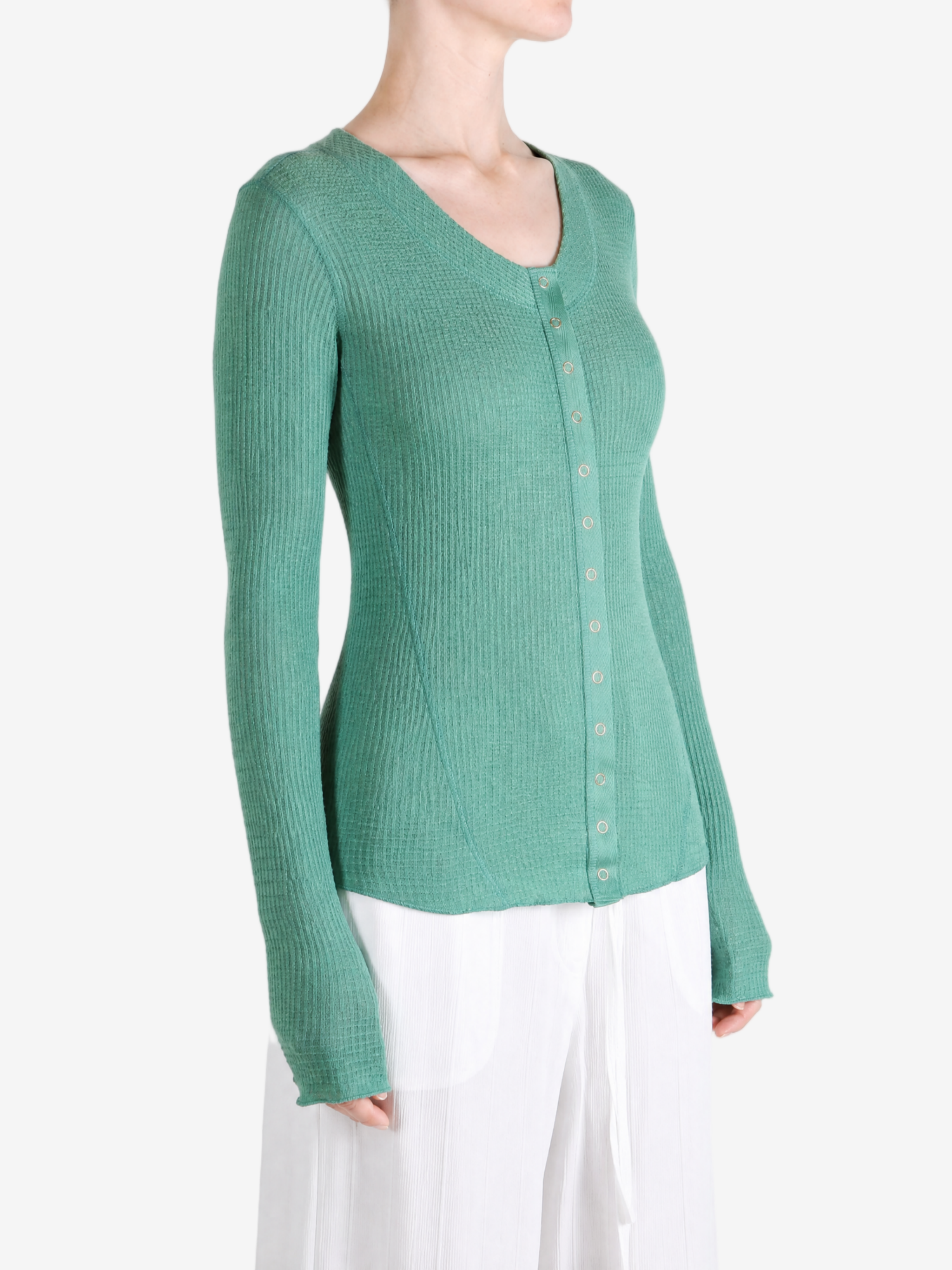 Green top worn by a person, showing the top fit
