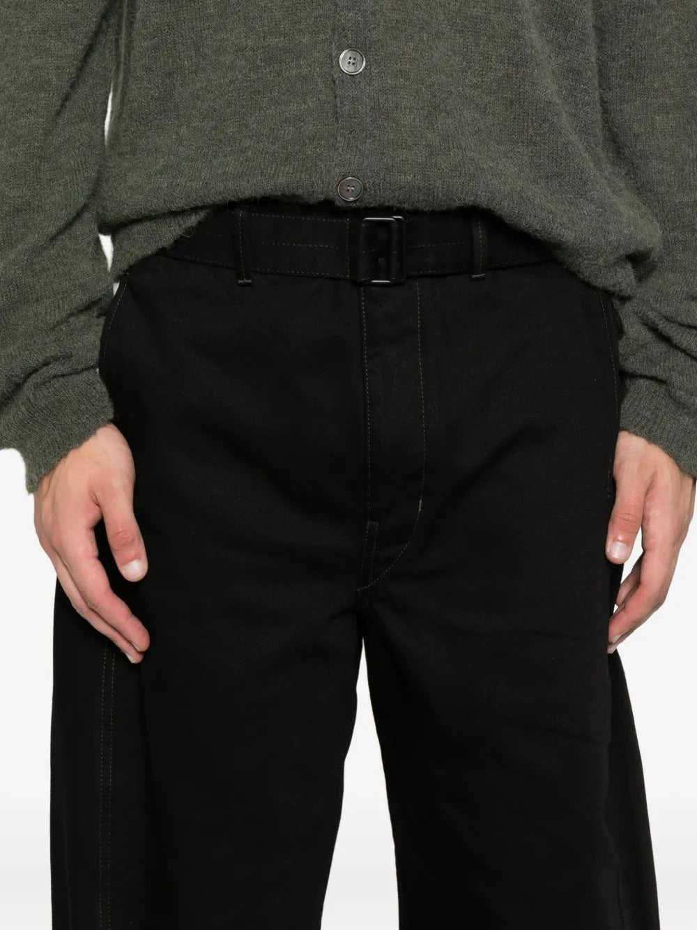 Close up of the black pants, showing texture of the cotton fabric