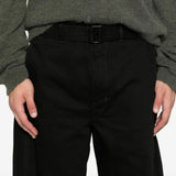 Close up of the black pants, showing texture of the cotton fabric