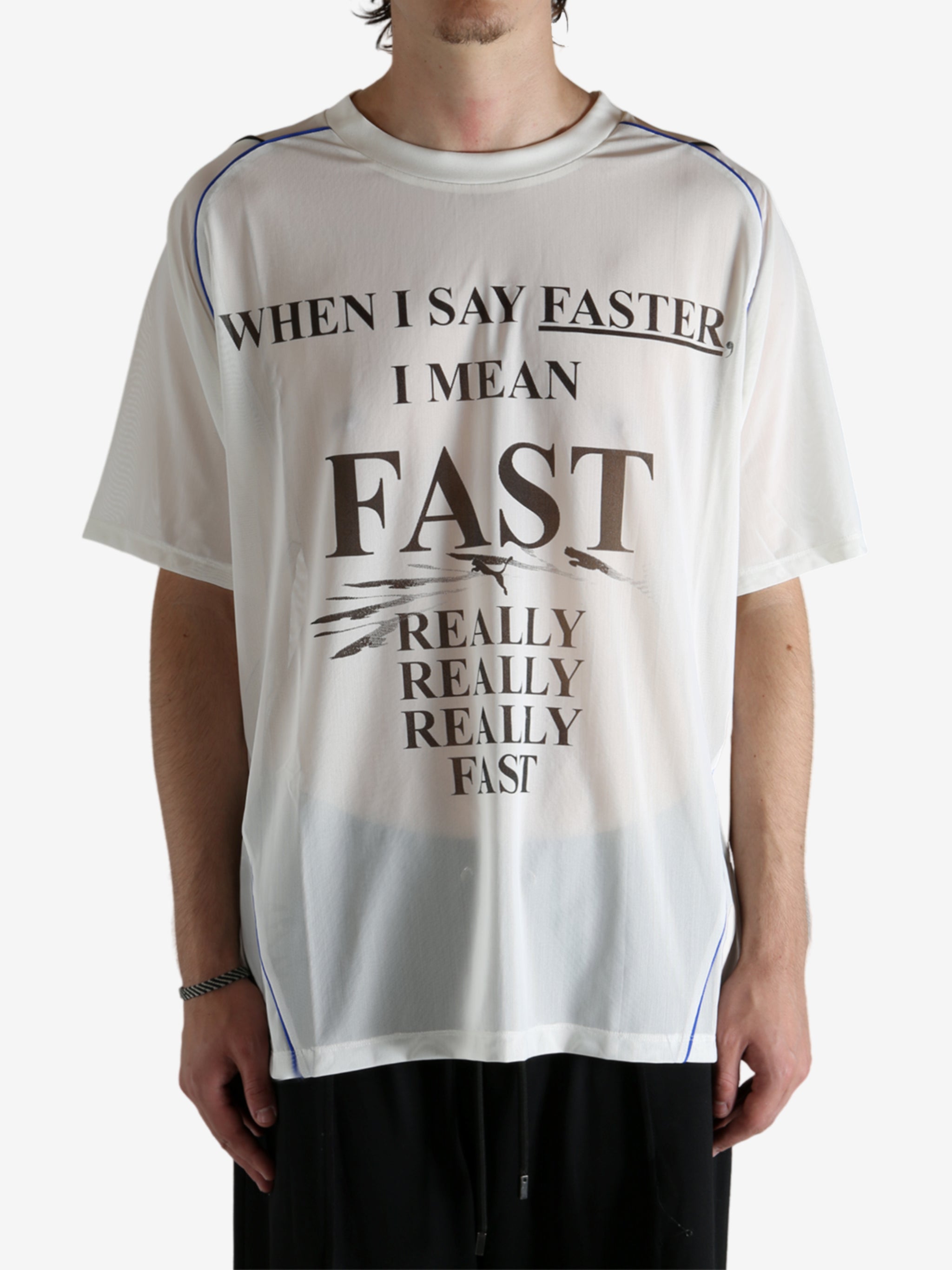 White shirt worn by a person, showing the shirt's fit