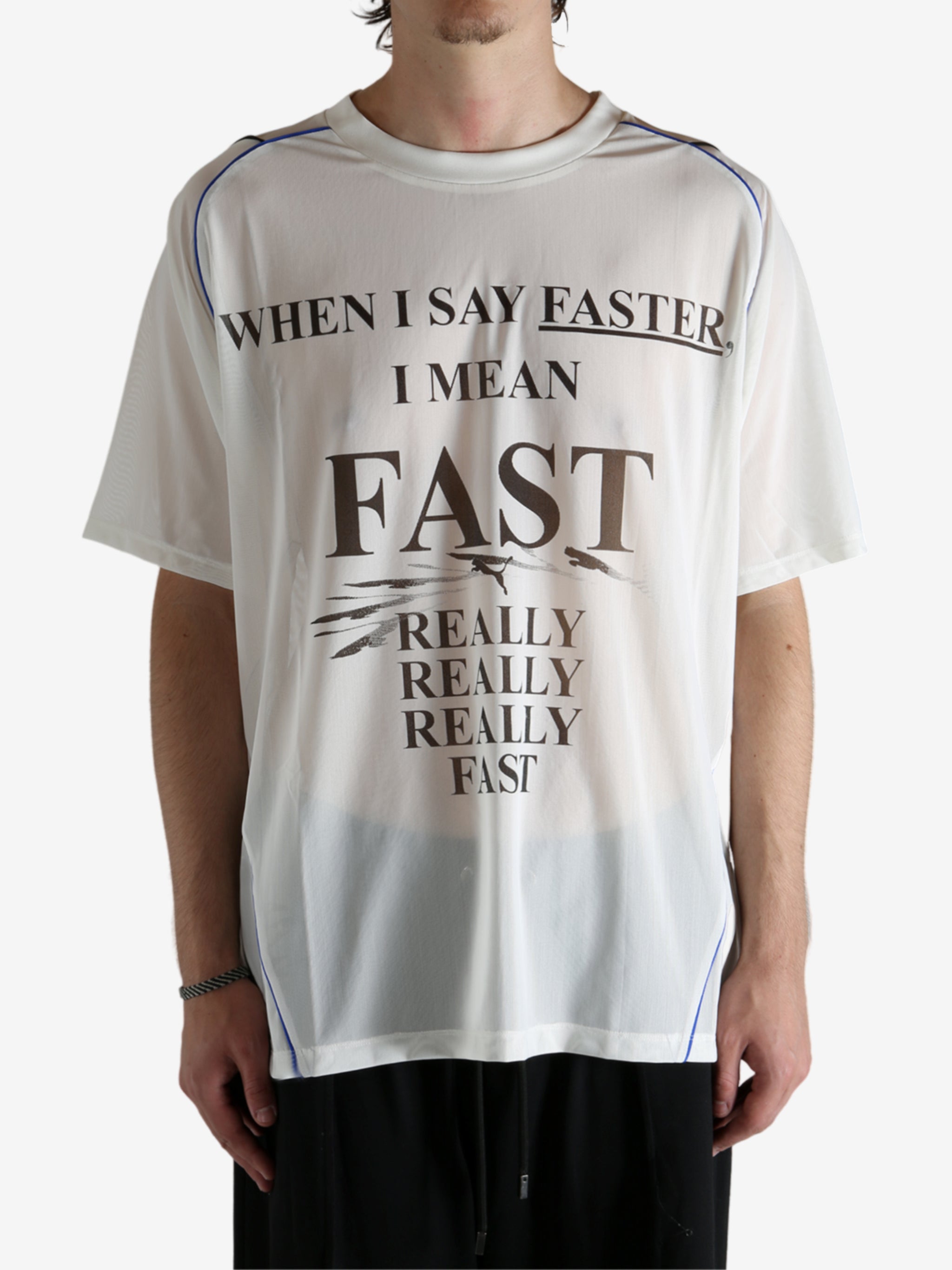 White shirt worn by a person, showing the shirt's fit