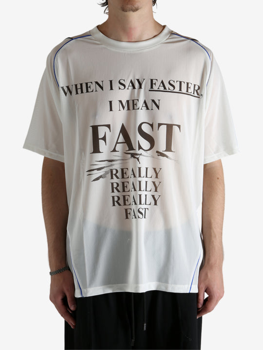 White shirt worn by a person, showing the shirt's fit