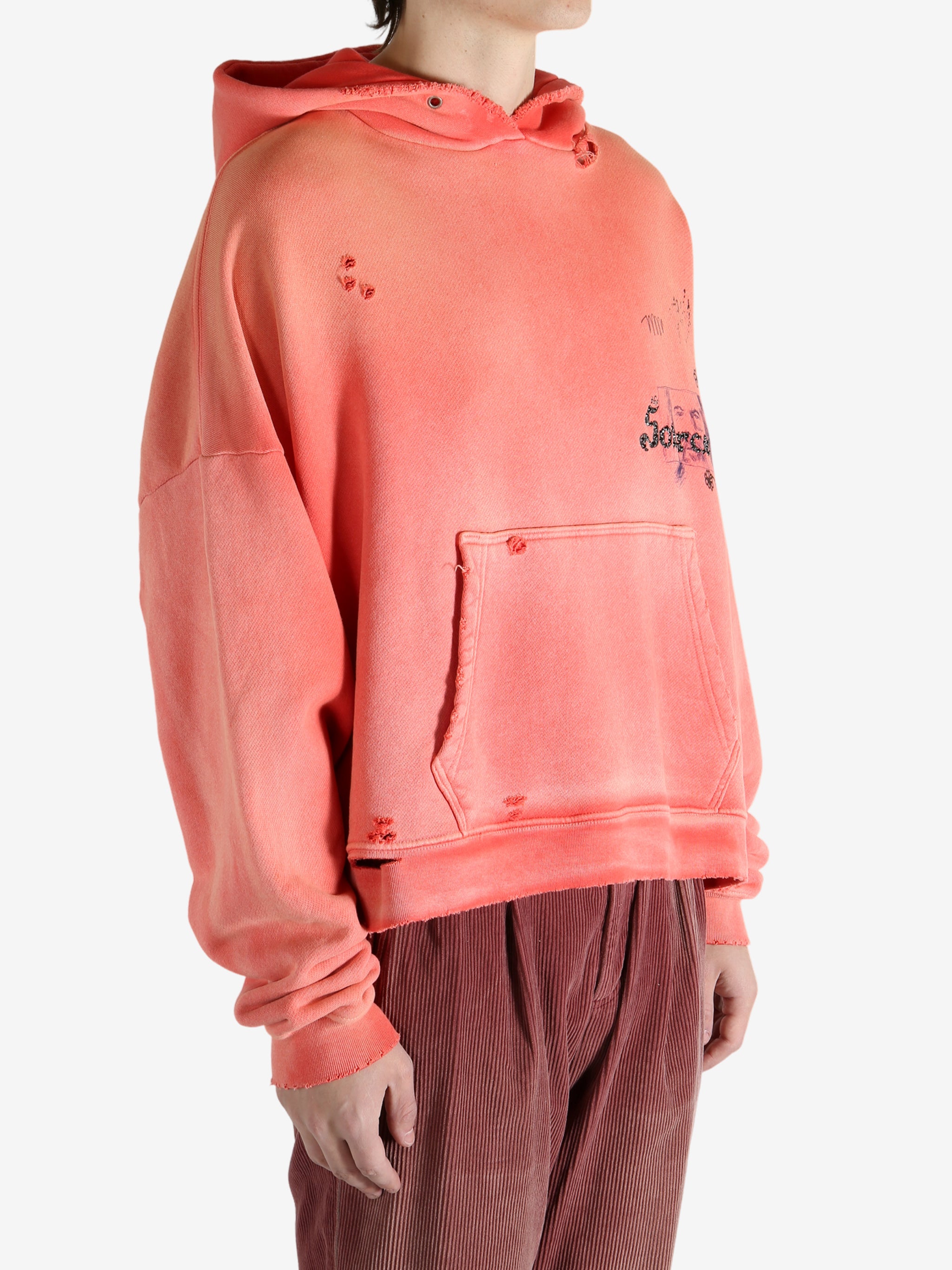 Red hoodie worn by a person, showing the hoodie fit