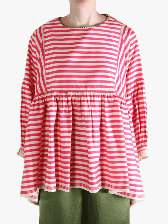 Red top worn by a person, showing the top's fit