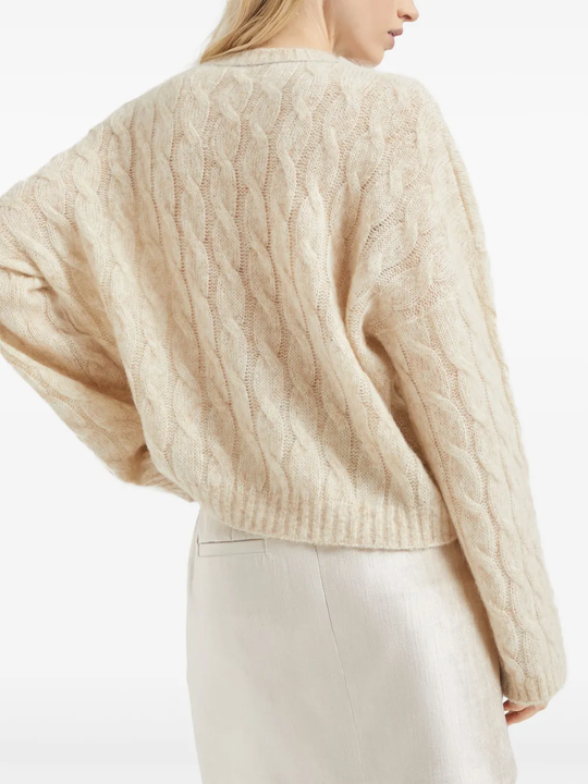Tan knitwears worn by a person, showing the knitwears fit