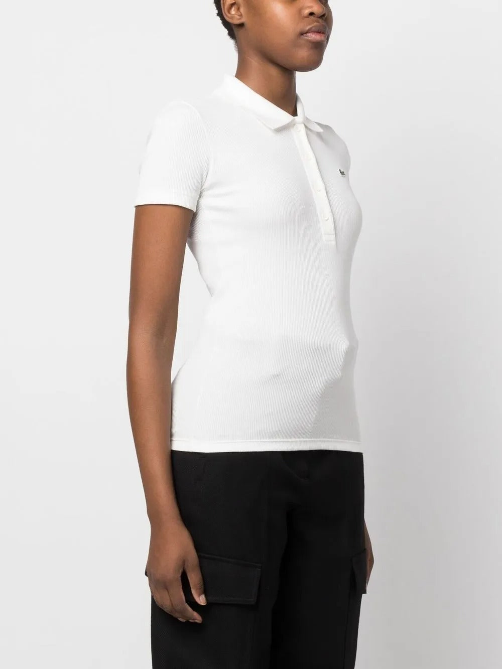 White shirt worn by a person, showing the shirt's fit