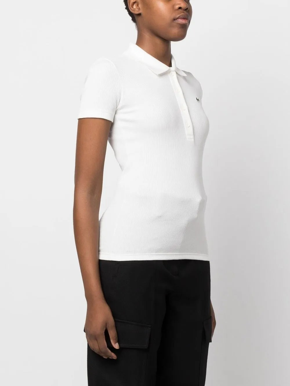 White shirt worn by a person, showing the shirt's fit